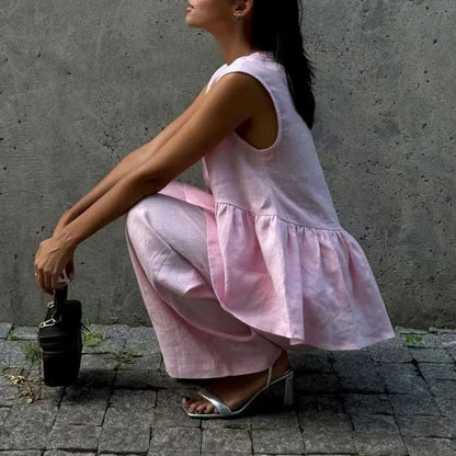 、👚 Set două piese: top fără mâneci, guler în V + pantaloni largi – stil lejer, elegant, perfect pentru vară. 🌸 Plată la livrare!