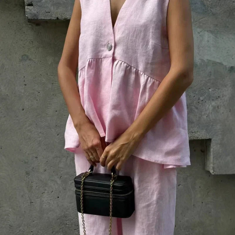 、👚 Set două piese: top fără mâneci, guler în V + pantaloni largi – stil lejer, elegant, perfect pentru vară. 🌸 Plată la livrare!