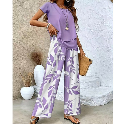 🌿 Set două piese femei – imprimeu frunze + pantaloni cu picior larg. Elegant, confortabil și perfect pentru vară! 🔥 Plătești DOAR la livrare în România. ✅ Comandă acum – stoc limitat!