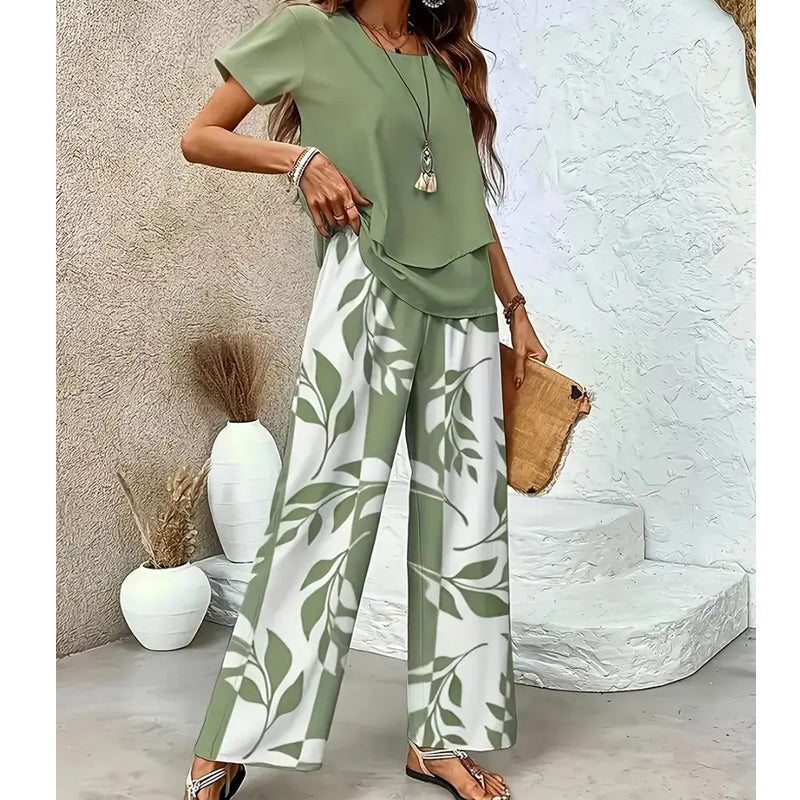 🌿 Set două piese femei – imprimeu frunze + pantaloni cu picior larg. Elegant, confortabil și perfect pentru vară! 🔥 Plătești DOAR la livrare în România. ✅ Comandă acum – stoc limitat!