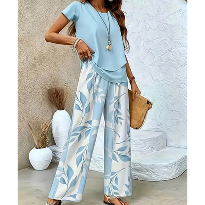 🌿 Set două piese femei – imprimeu frunze + pantaloni cu picior larg. Elegant, confortabil și perfect pentru vară! 🔥 Plătești DOAR la livrare în România. ✅ Comandă acum – stoc limitat!